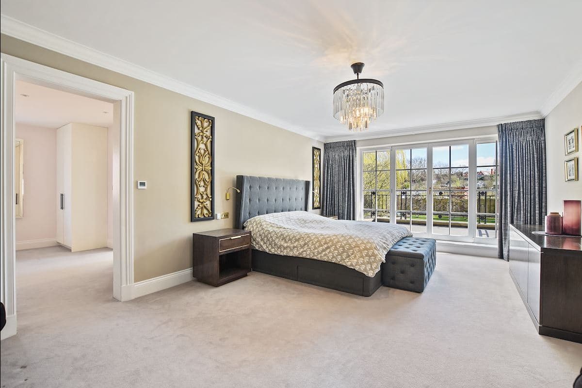A London master bedroom with warm evening circadian lighting