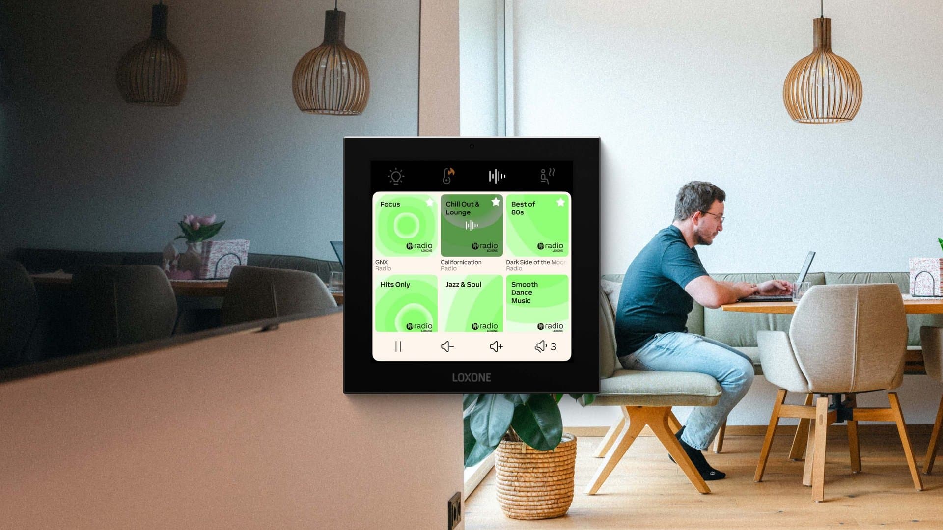 A Loxone Touch Pure switch in a warmly lit living room