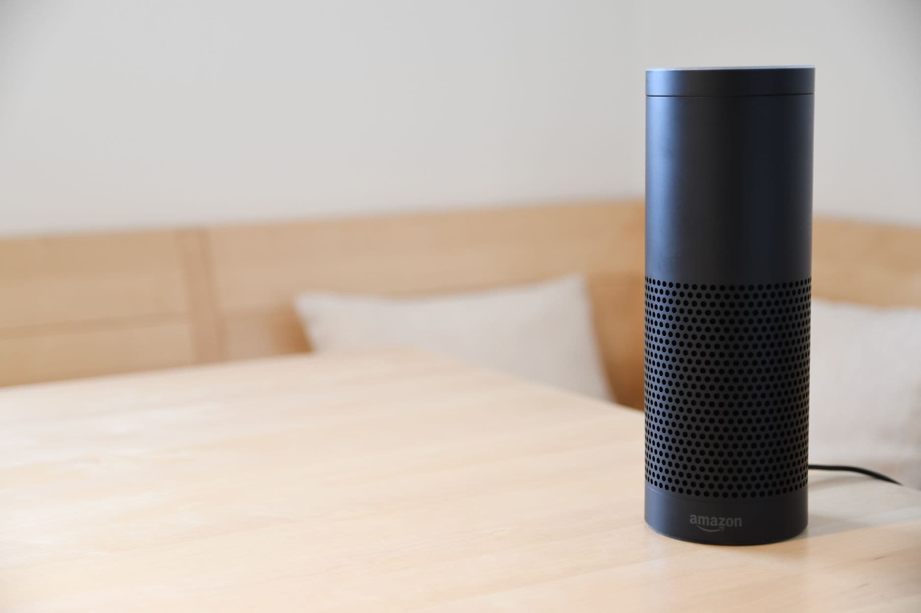 A single smart speaker on a wooden table — useful, but not a smart home